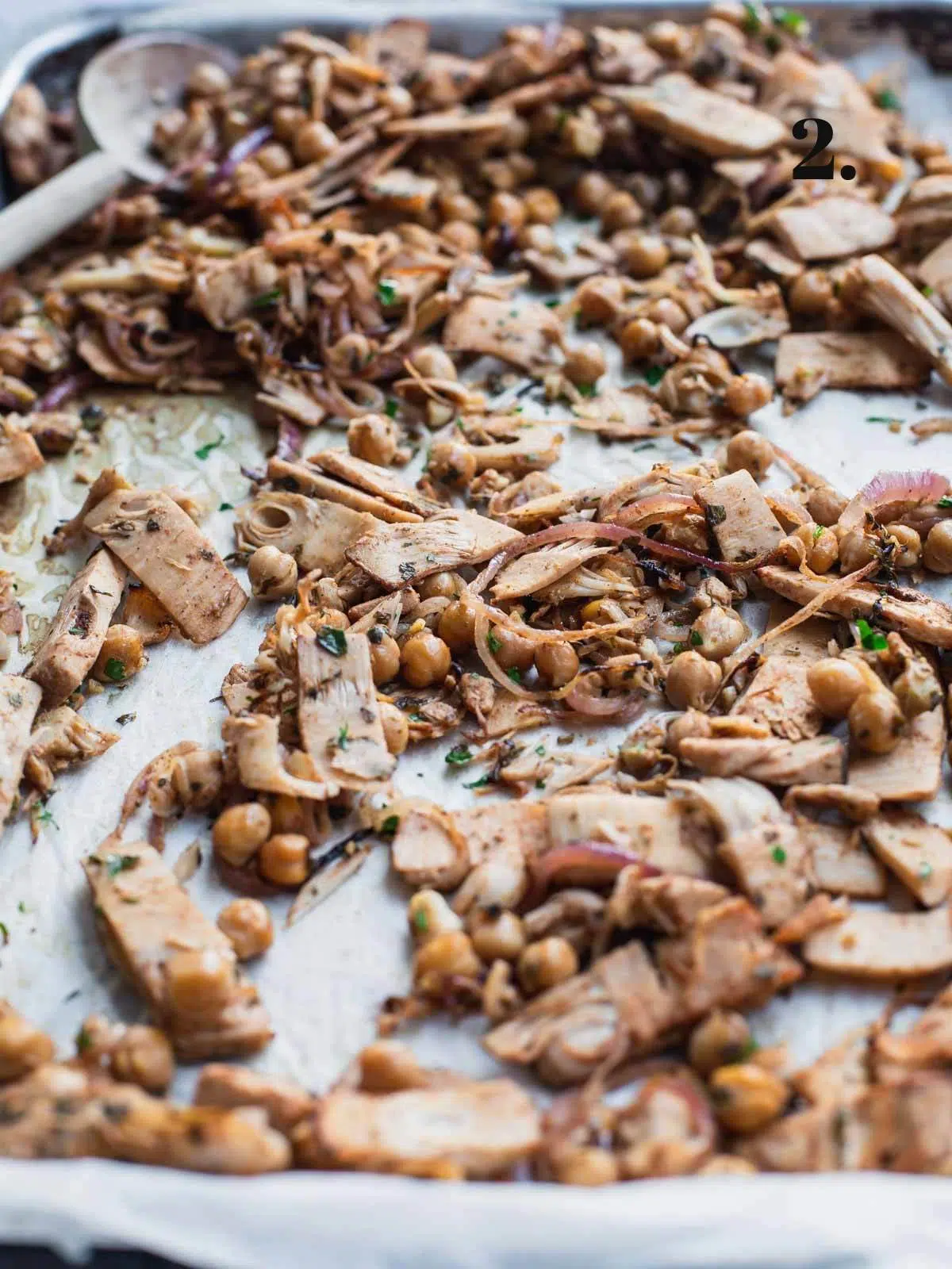 Roasted jackfruit and chickpeas on a roasting tray.