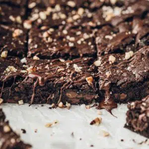 Close up image of sliced brownies with melted chocolate.