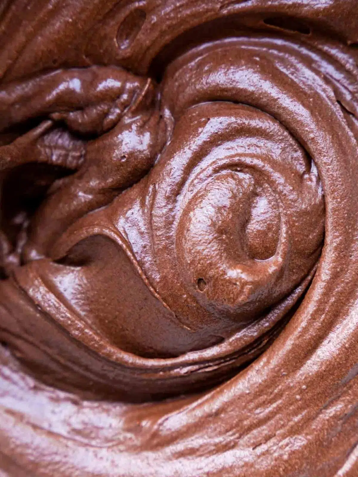 Swirls of chocolate cake batter.