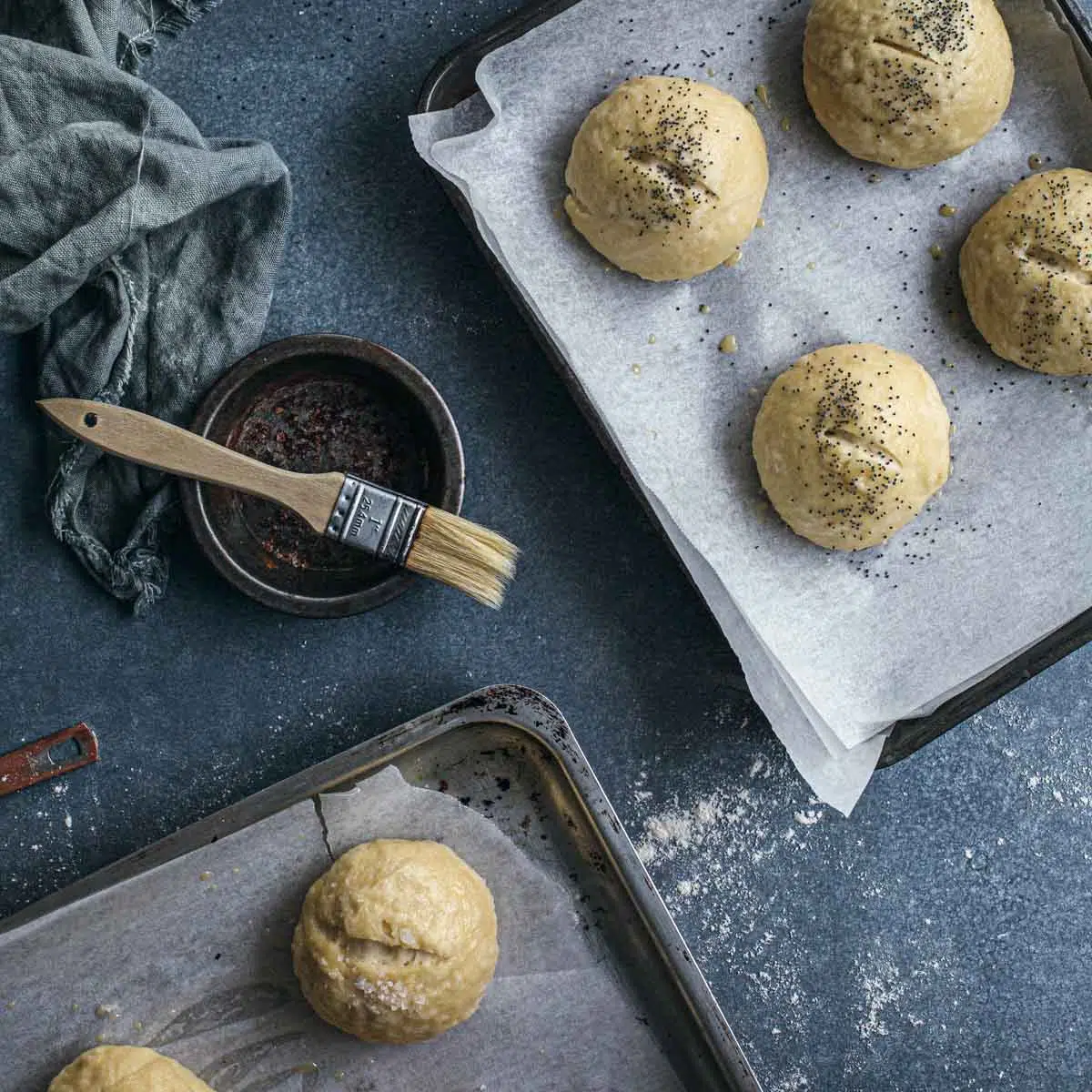 Boiled pretzel buns before baking.