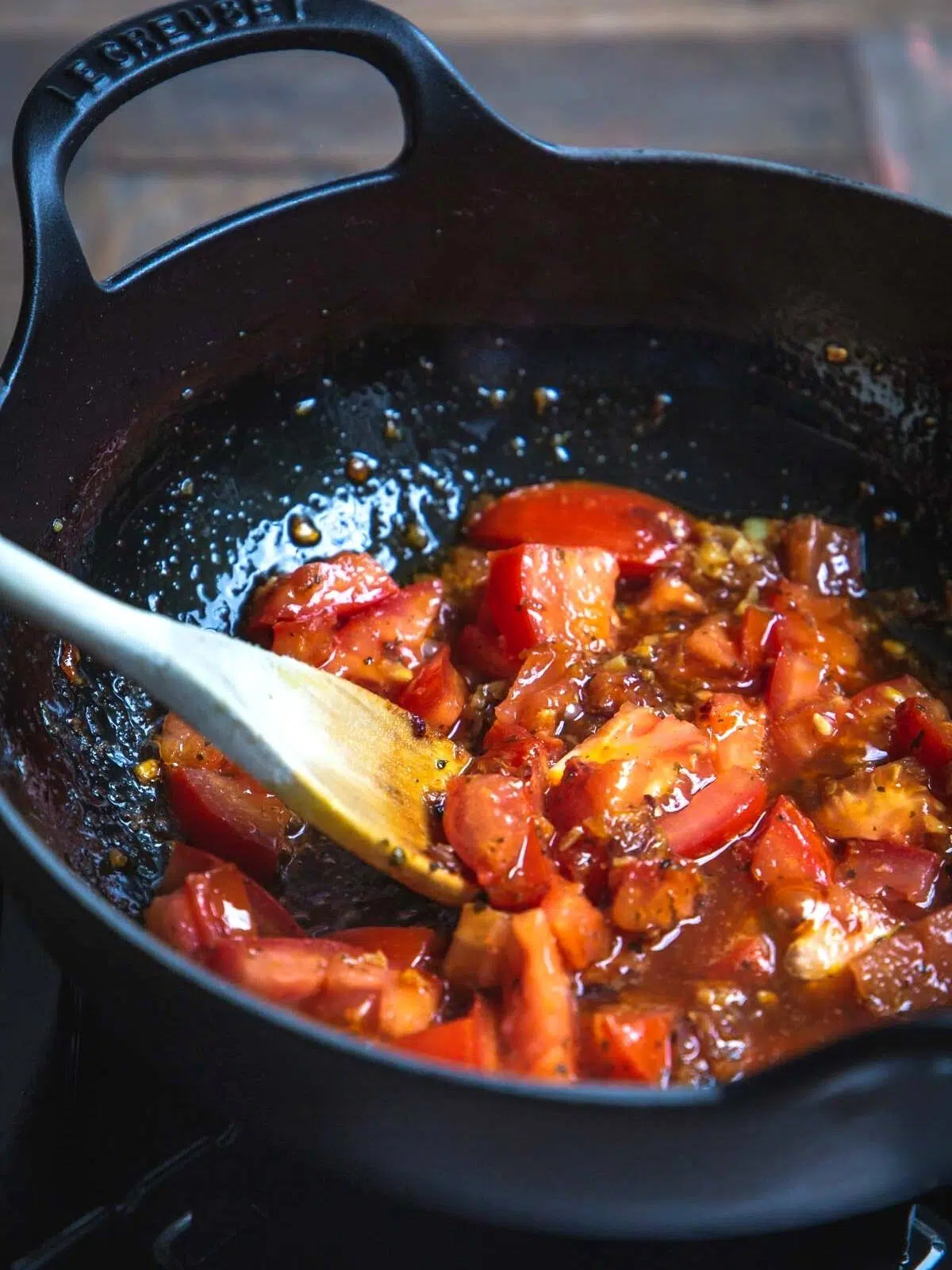 Cooked tomatoes and spices in a pot. 