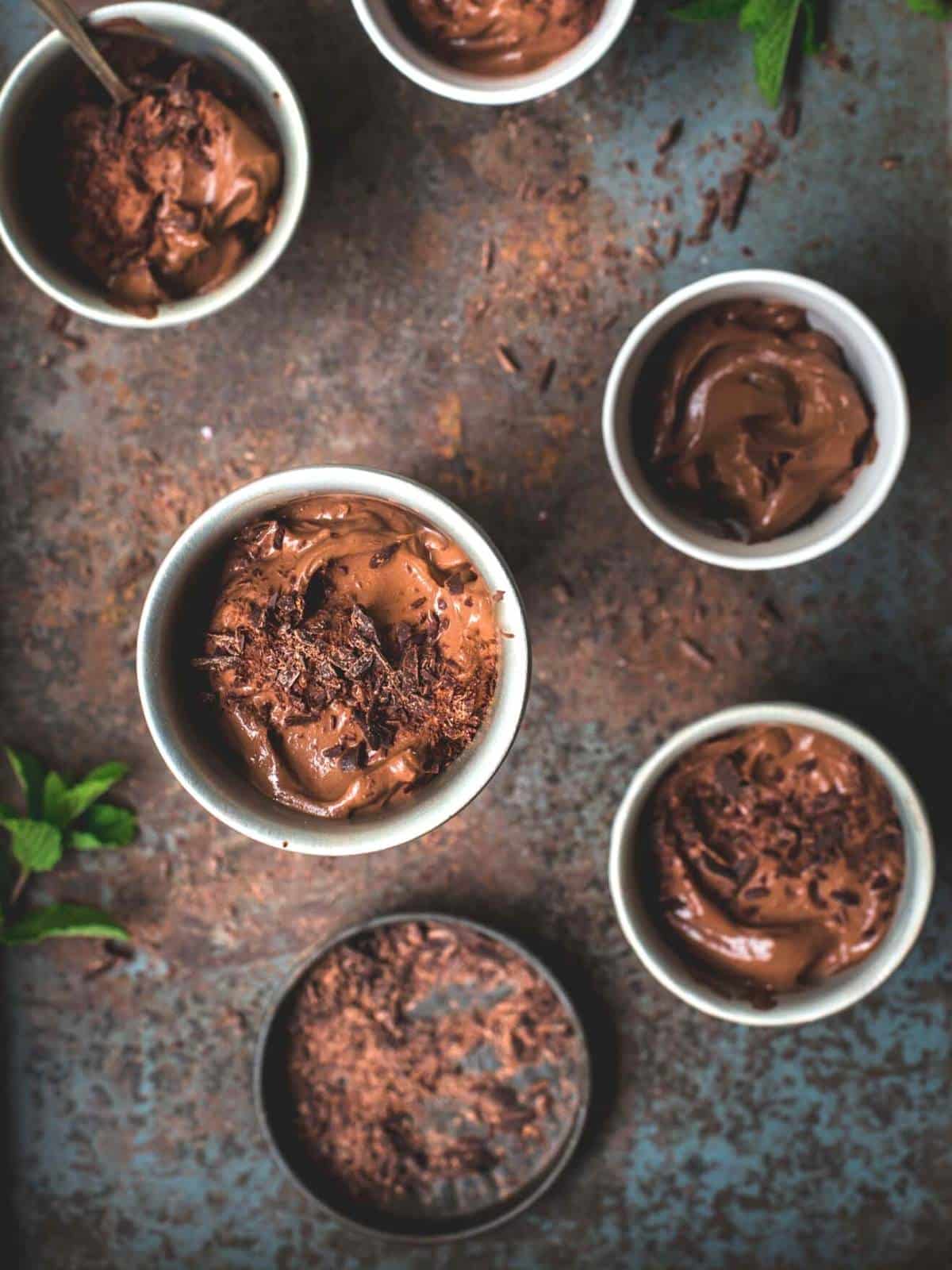 Chocolate mousse in pots with chocolate shavings.