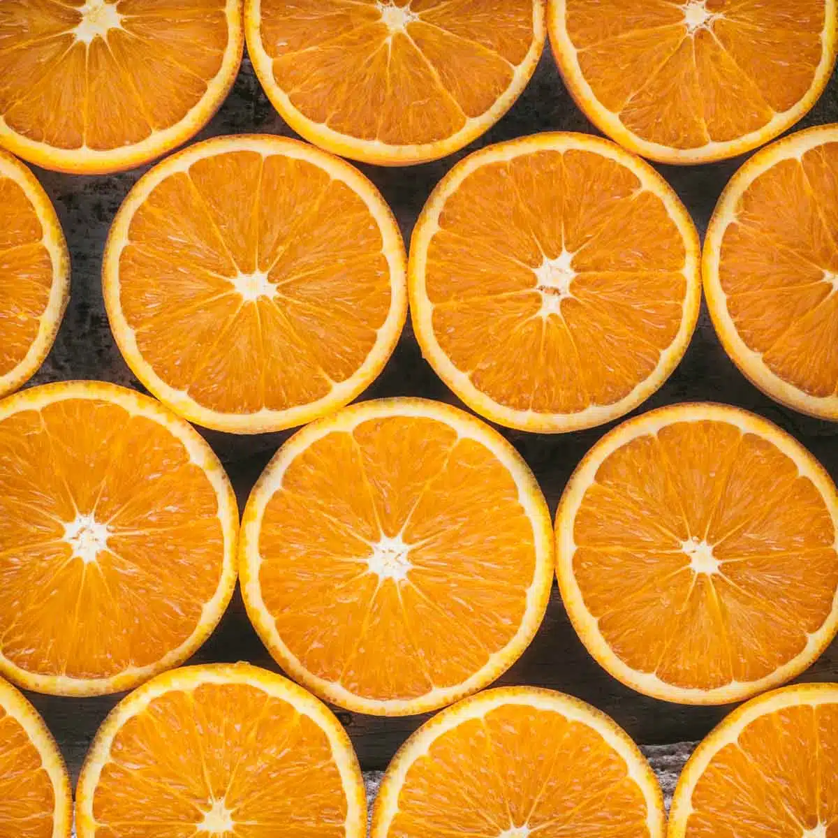Cut oranges on a platter.