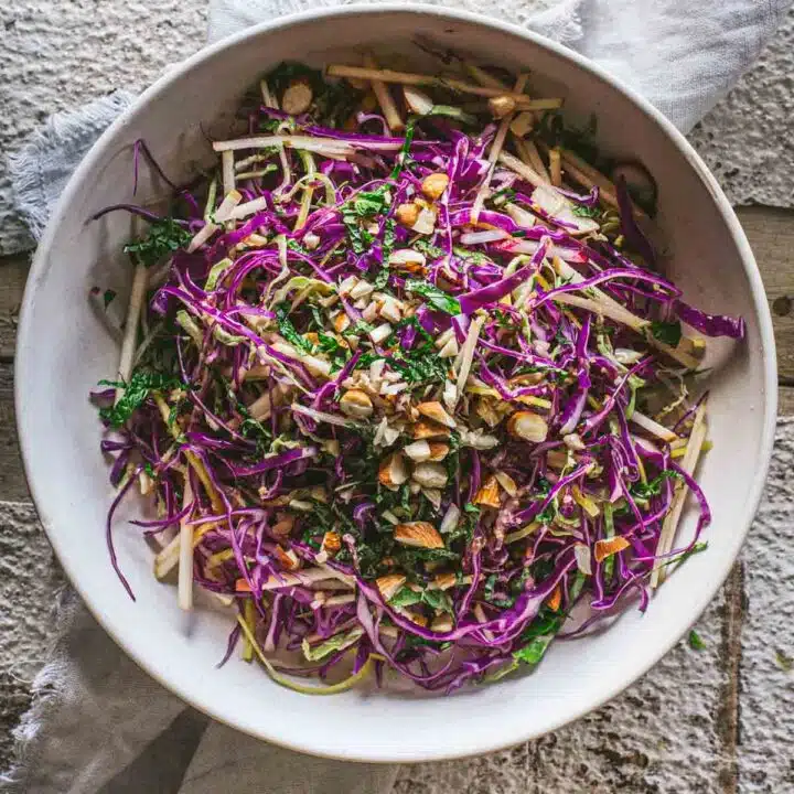 A large bowl of rainbow vegetable salad.