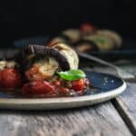 Stuffed eggplant roll on a plate.