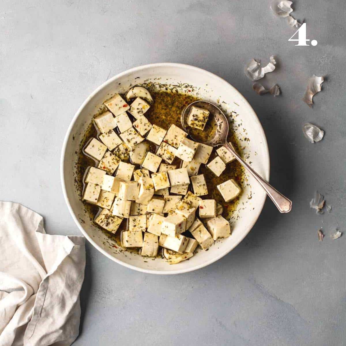 Marinate tofu feta in a bowl.