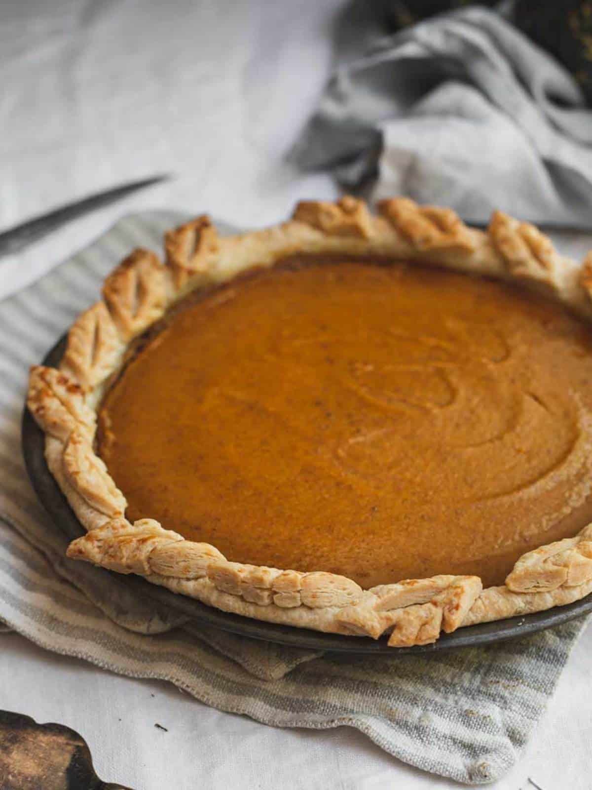 Baked pumpkin pie with shortcrust pastry.