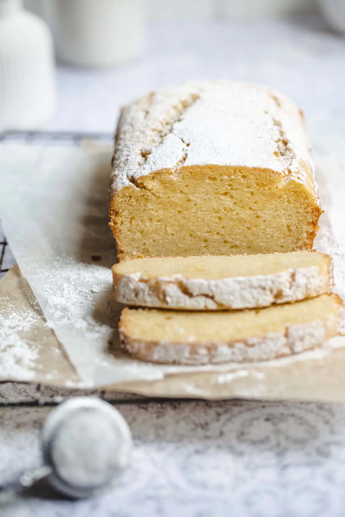 A sliced cake on a cooling rack.