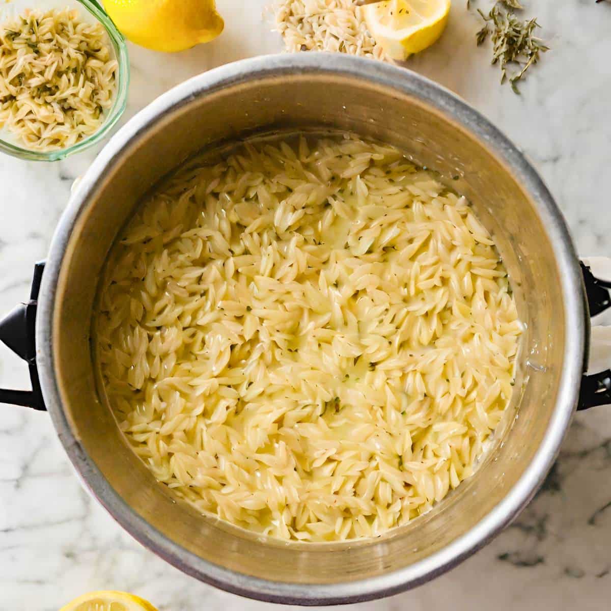 Orzo cooking in a pot.