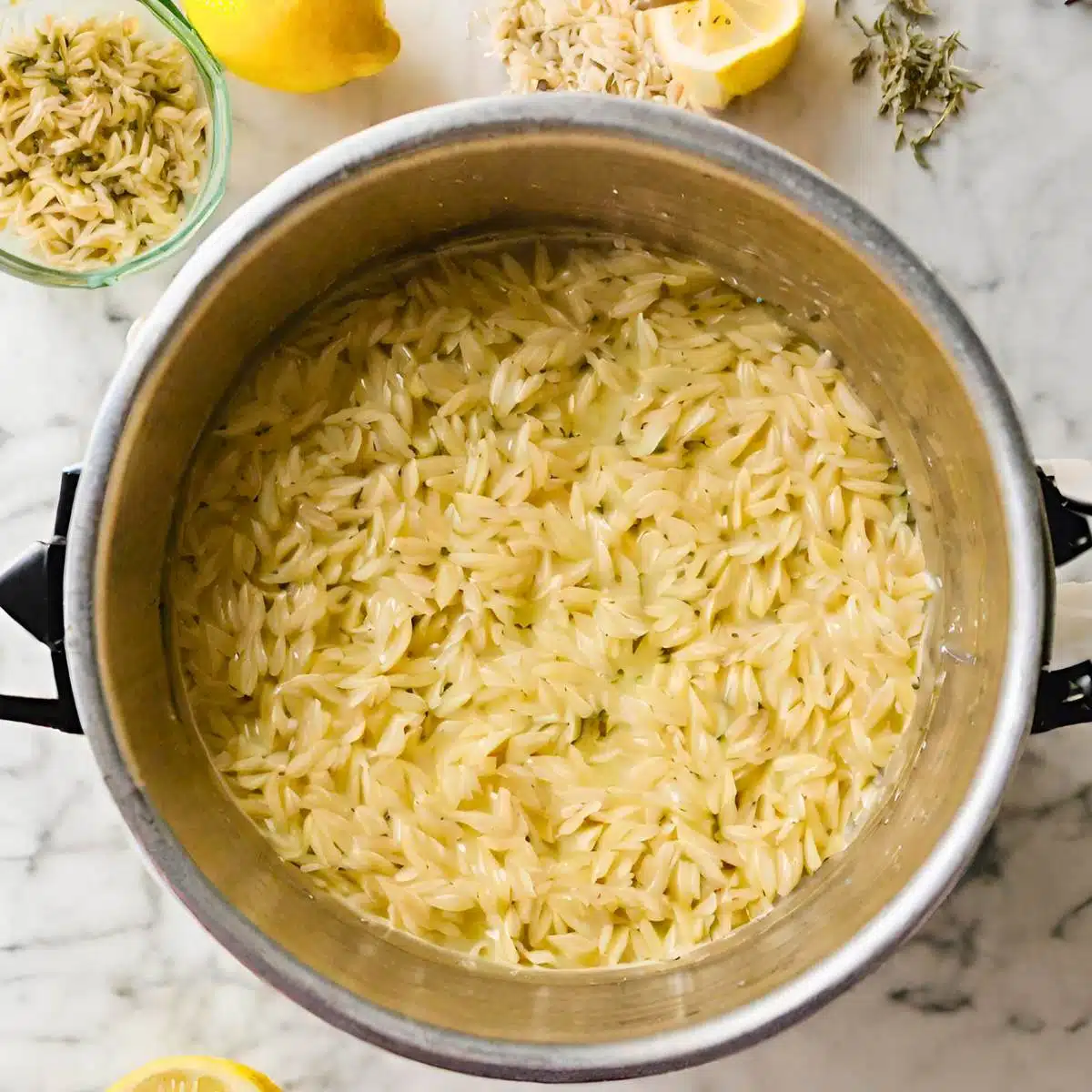 Orzo cooking in a pot. 