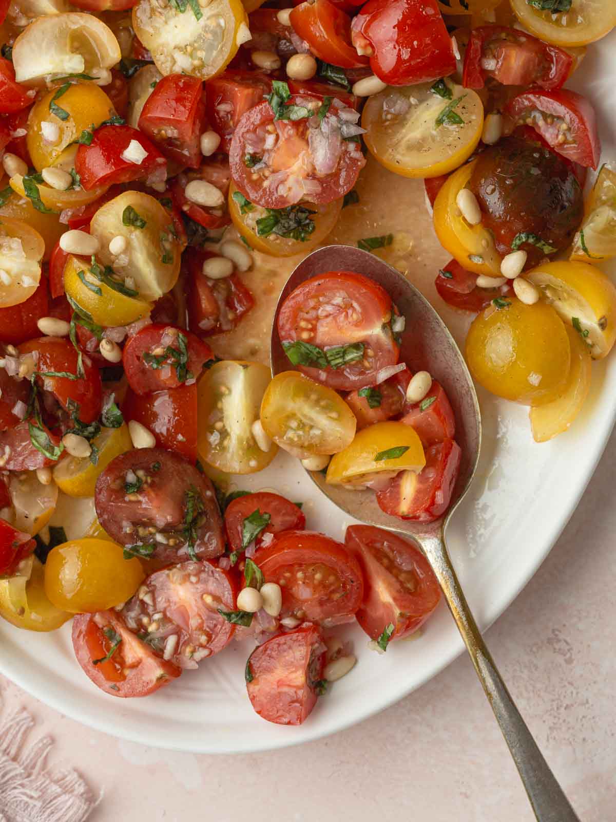 Tomato and onion salad on a plate close up.
