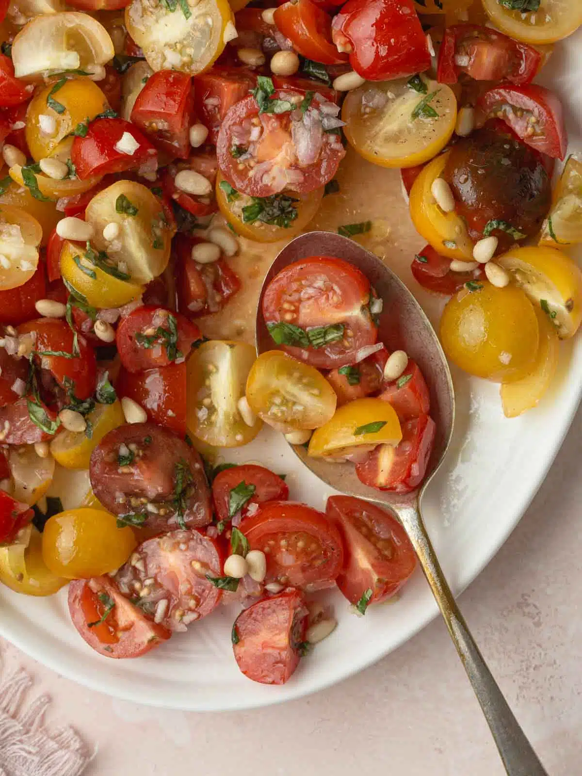 Tomato and onion salad on a plate close up.