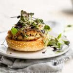 A cauliflower burger on a plate without a bun top.