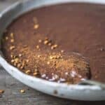 Chocolate chia pudding in a bowl with sprinkles.