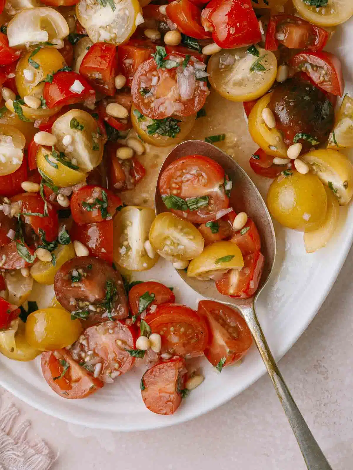 Tomato and onion salad on a plate close up.