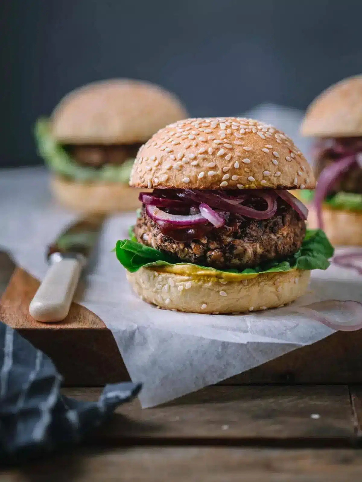 A vegan burger on a wooden board.