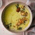 A bowl of soup with a napkin.