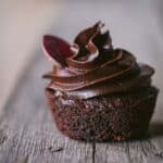 A cupcake with frosting.