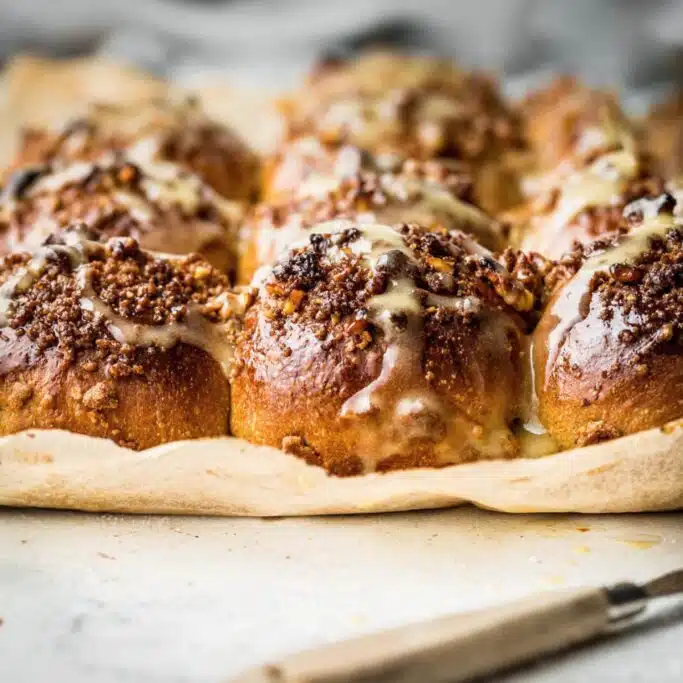 Sweet pastry rolls on baking paper.