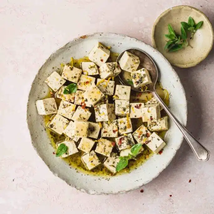 Marinated tofu cubes in a bowl. 