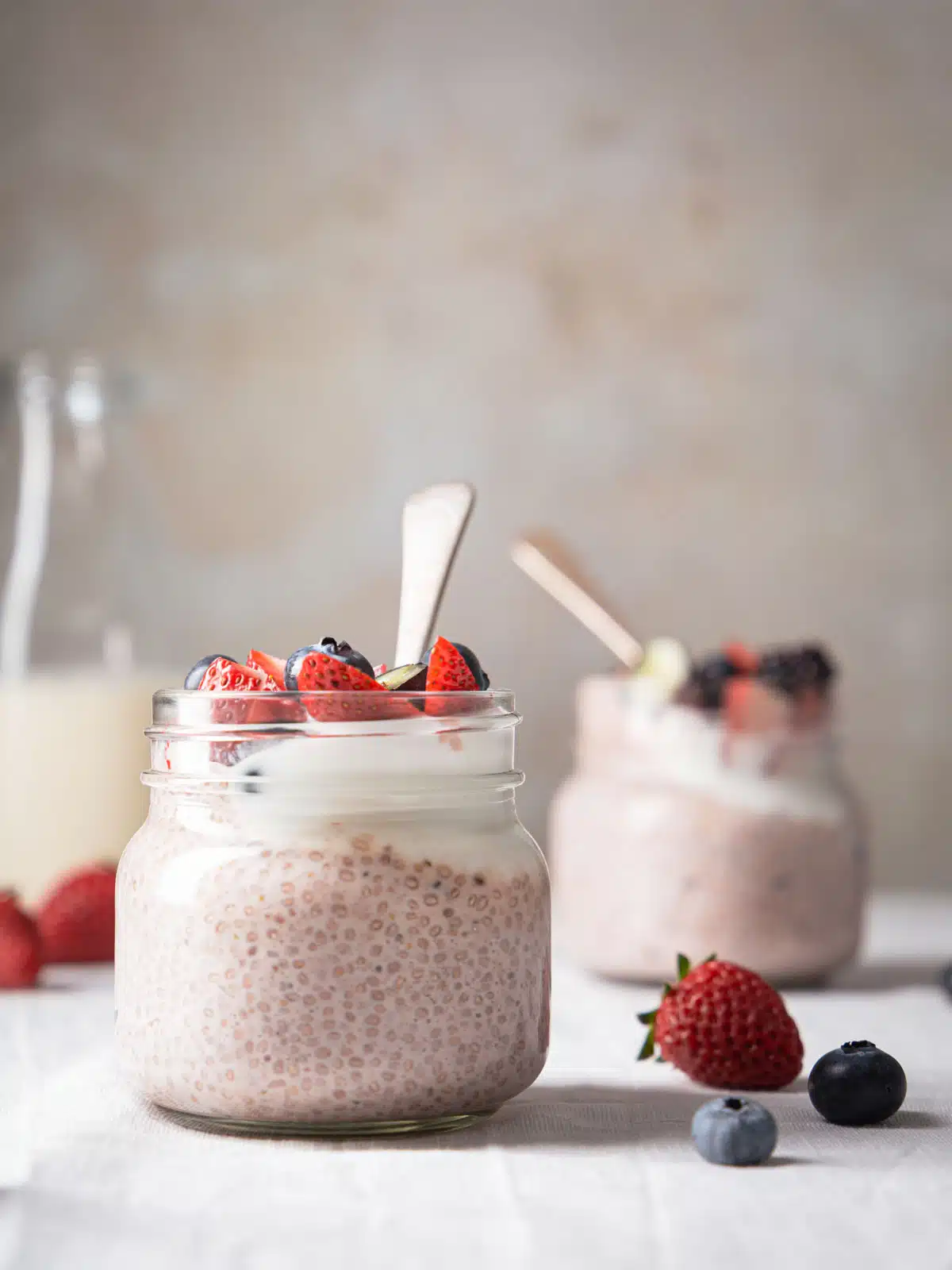 Jars of berries and chia pudding.