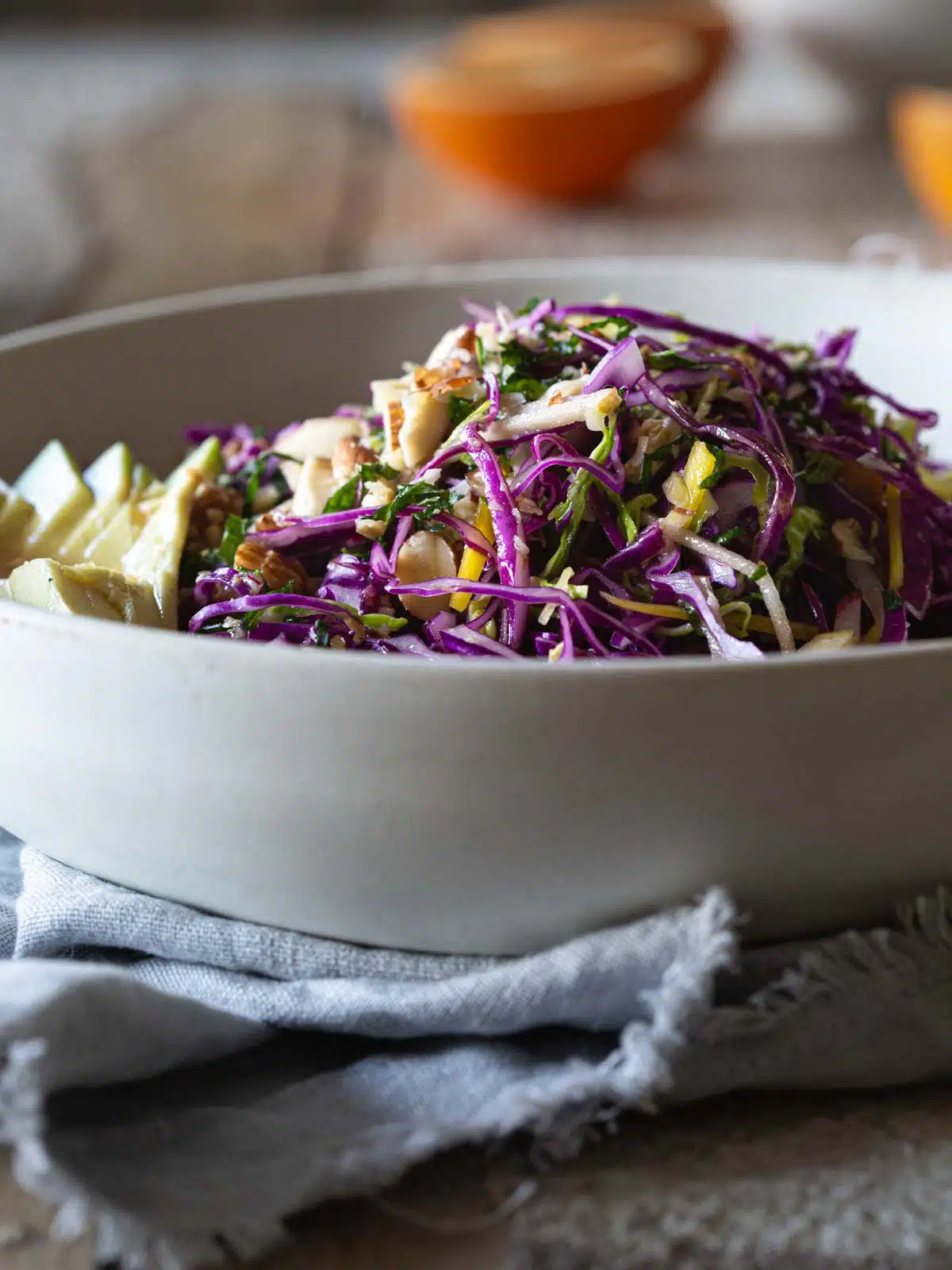 A bowl of rainbow salad on a table.