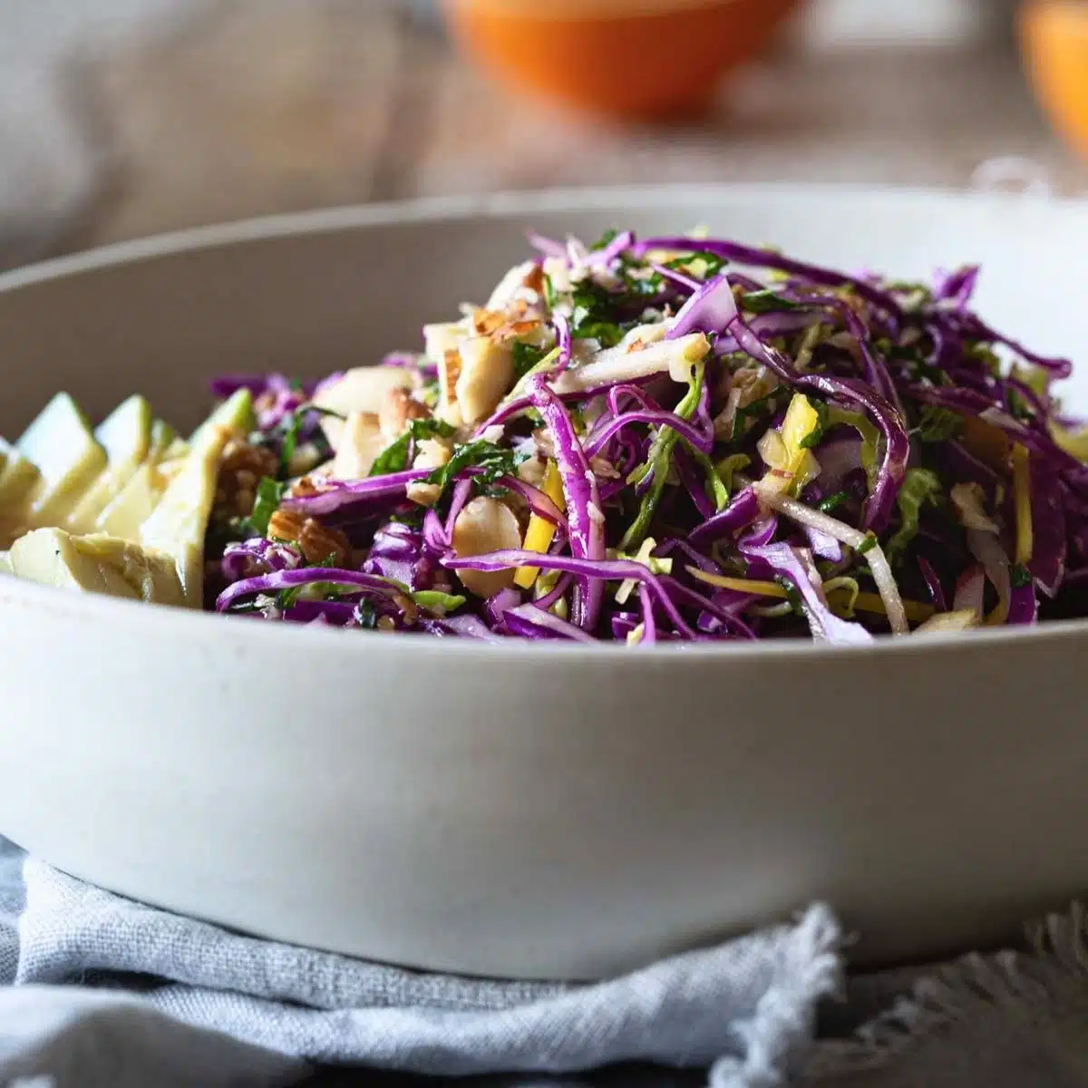A bowl of fibre-rich cabbage, avocado and apple salad.