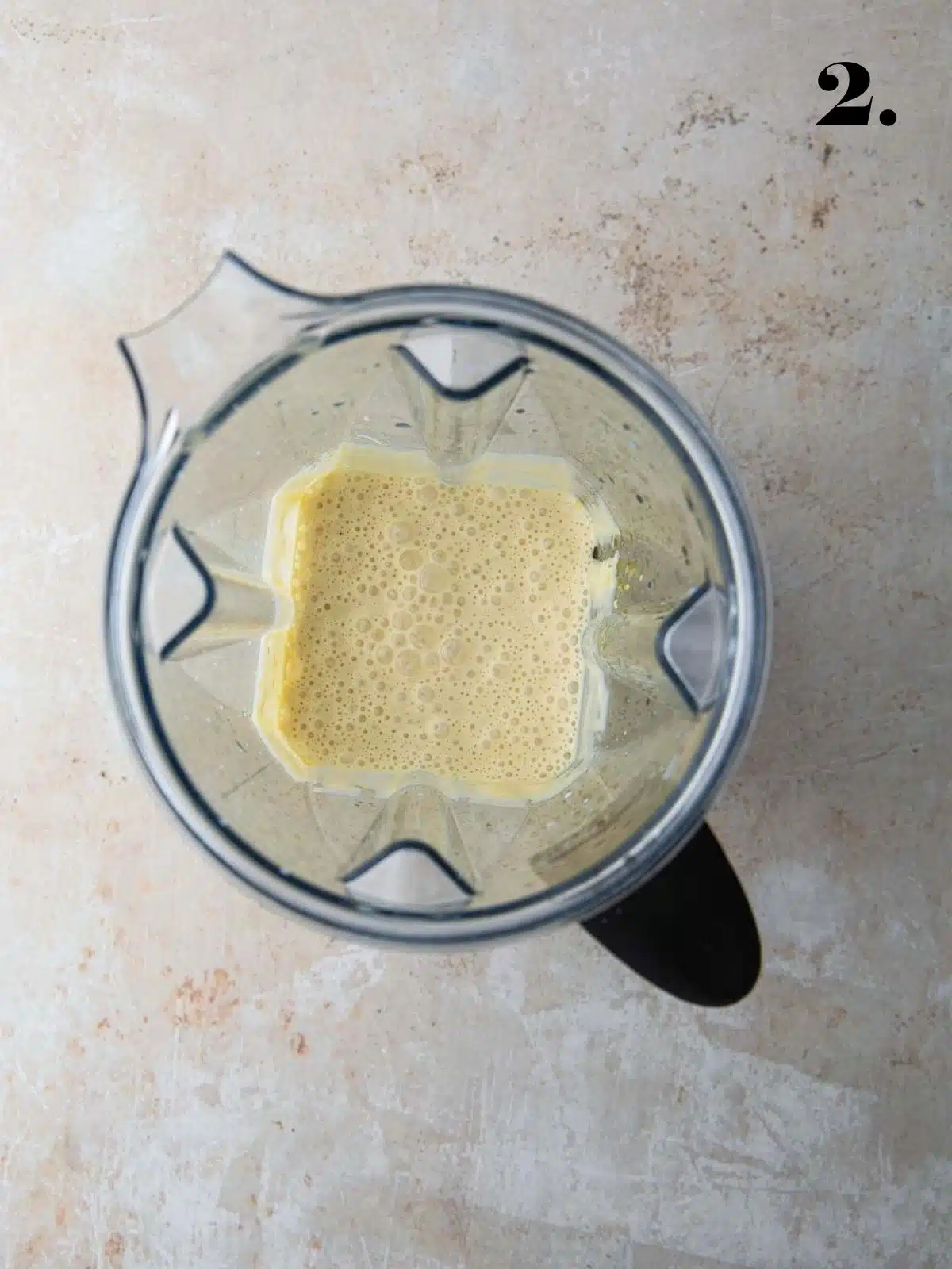 Tofu and nutritional yeast with soy milk in a blender blended into a creamy for Marry Me Chickpeas.